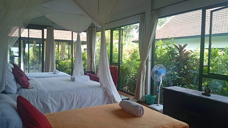 Large bright bedroom with big glass windows and doors and lush garden view at The Writers Nest Pavilion (Room 5), Ambary Ubud -3